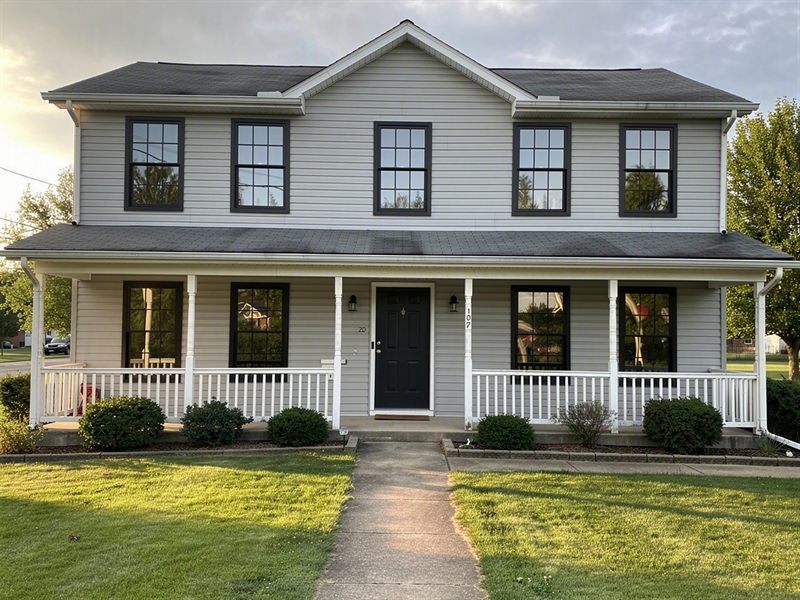 The same house with AI-previewed black Polaris windows